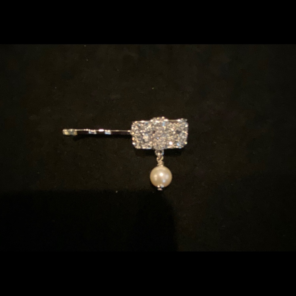 CHANEL crystal hair accessory.